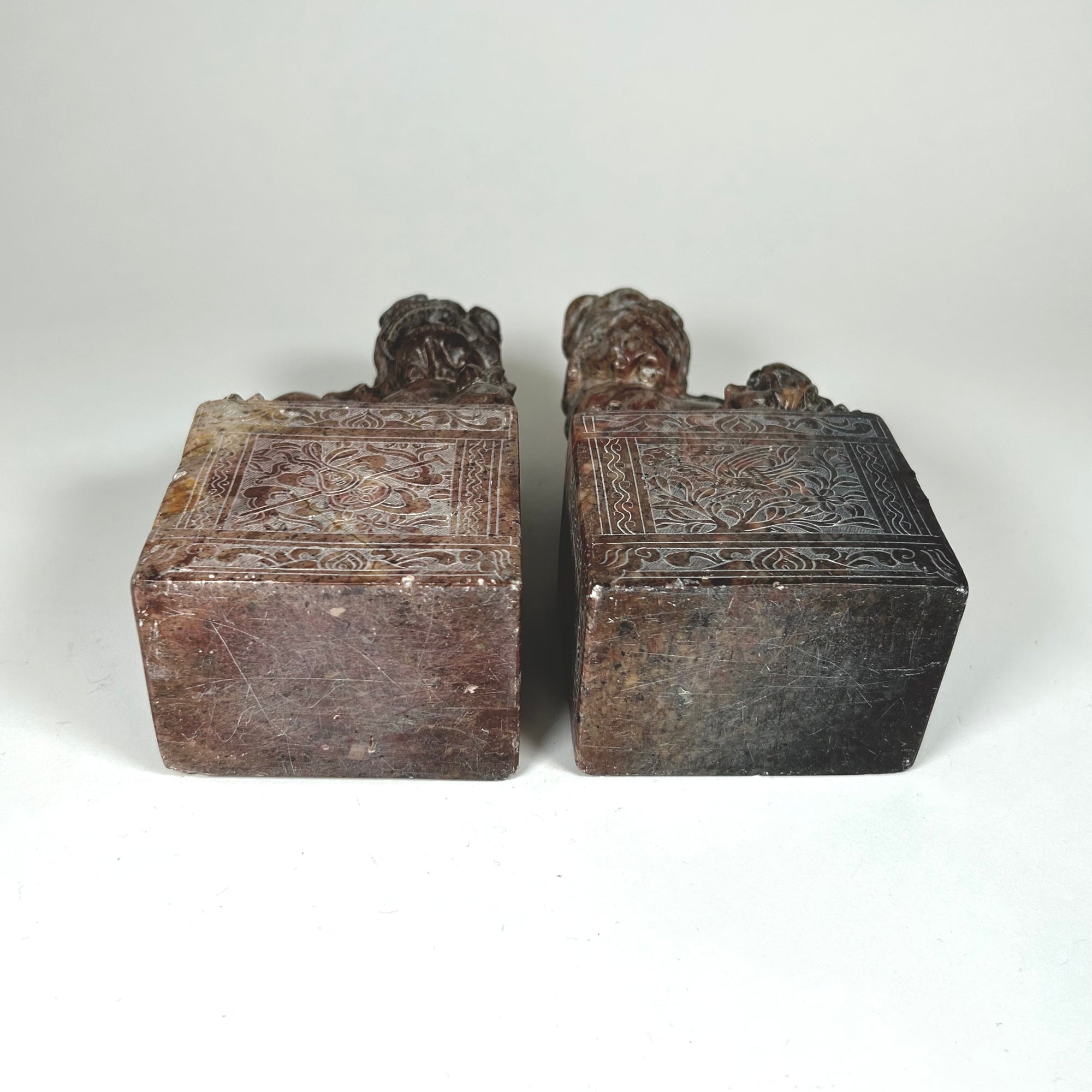 Small Hardstone Foo Dog Pair on Plinths - Carved with Floral Design - Red / Grey Stone