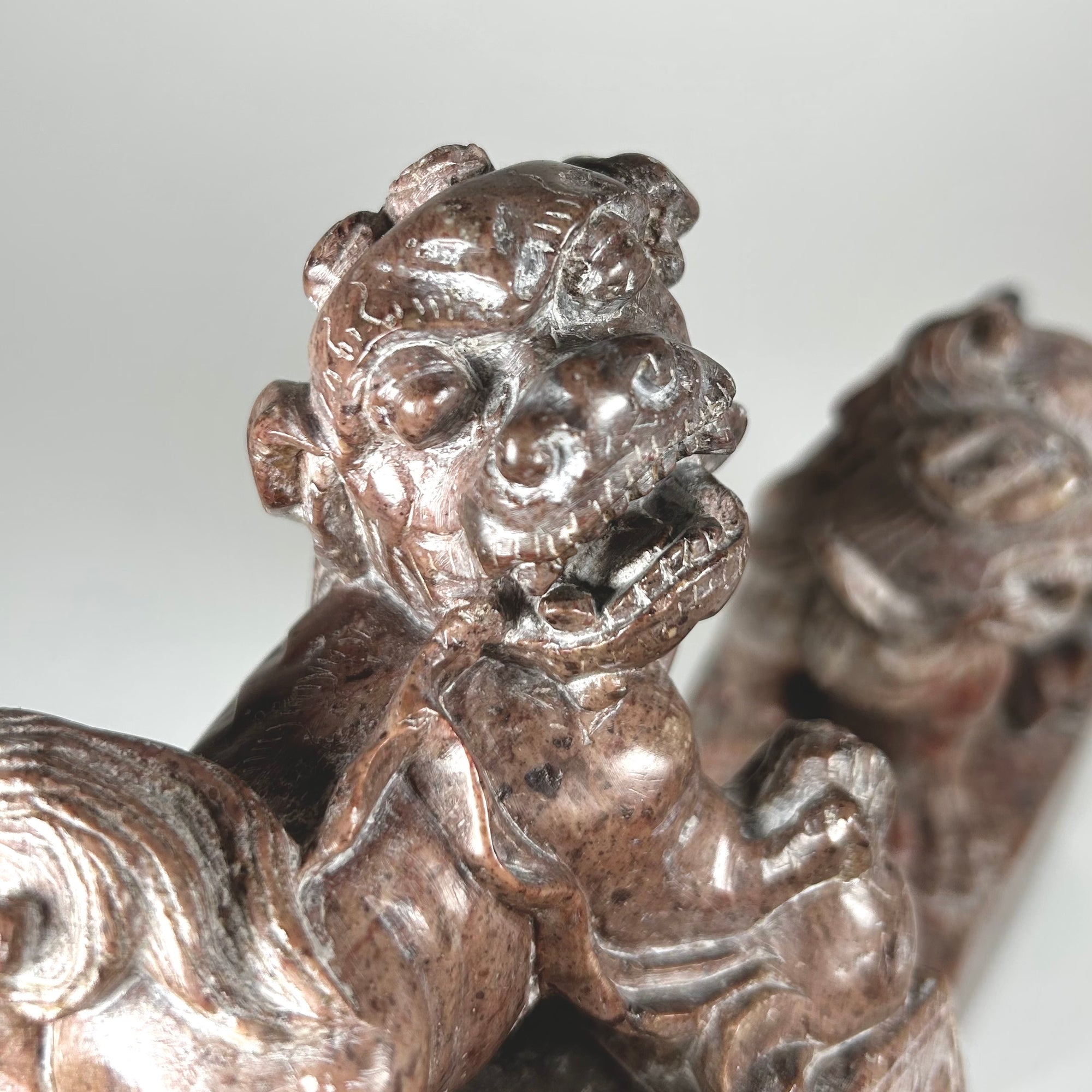Small Hardstone Foo Dog Pair on Plinths - Carved with Floral Design - Red / Grey Stone